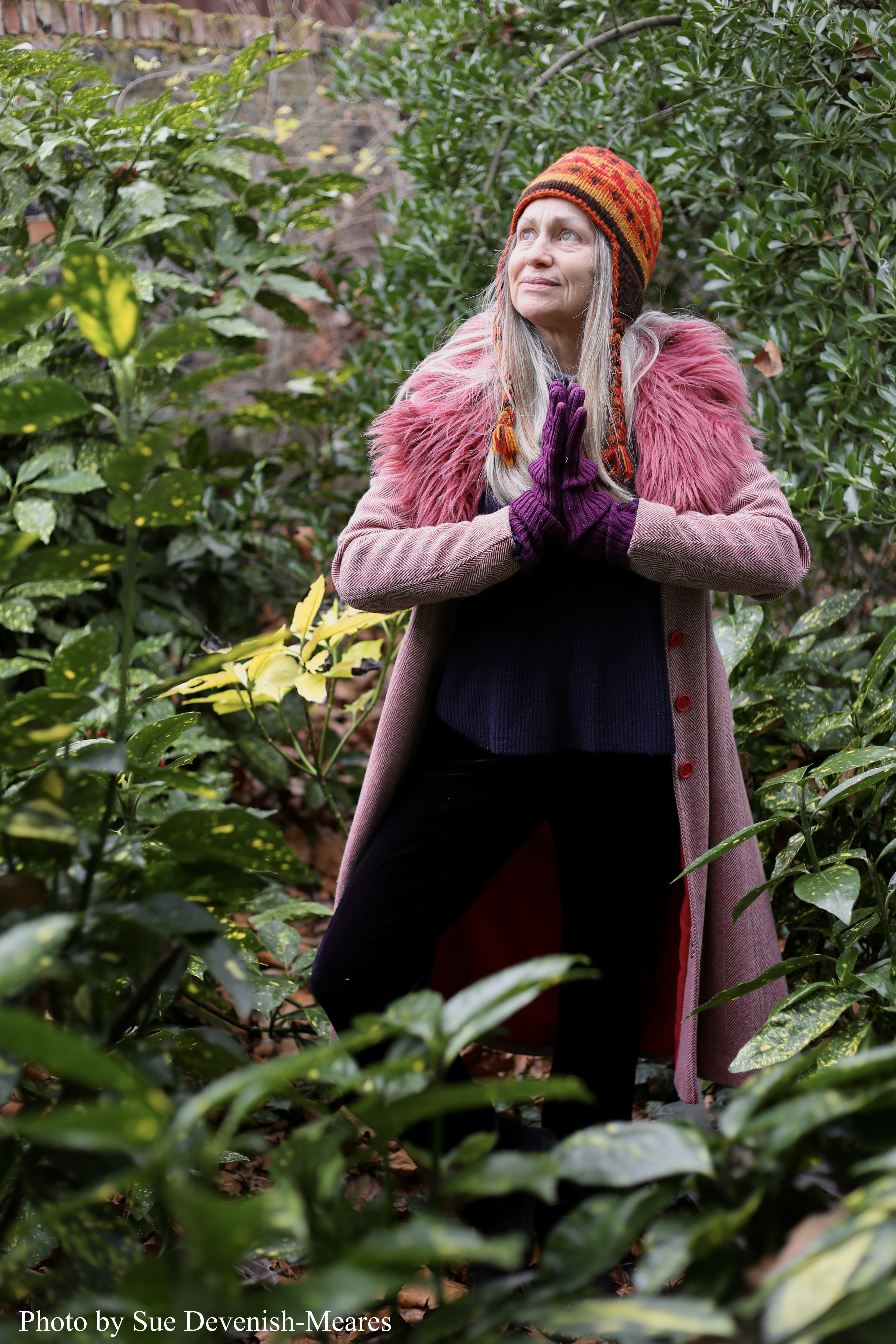 Pink coat in bushes